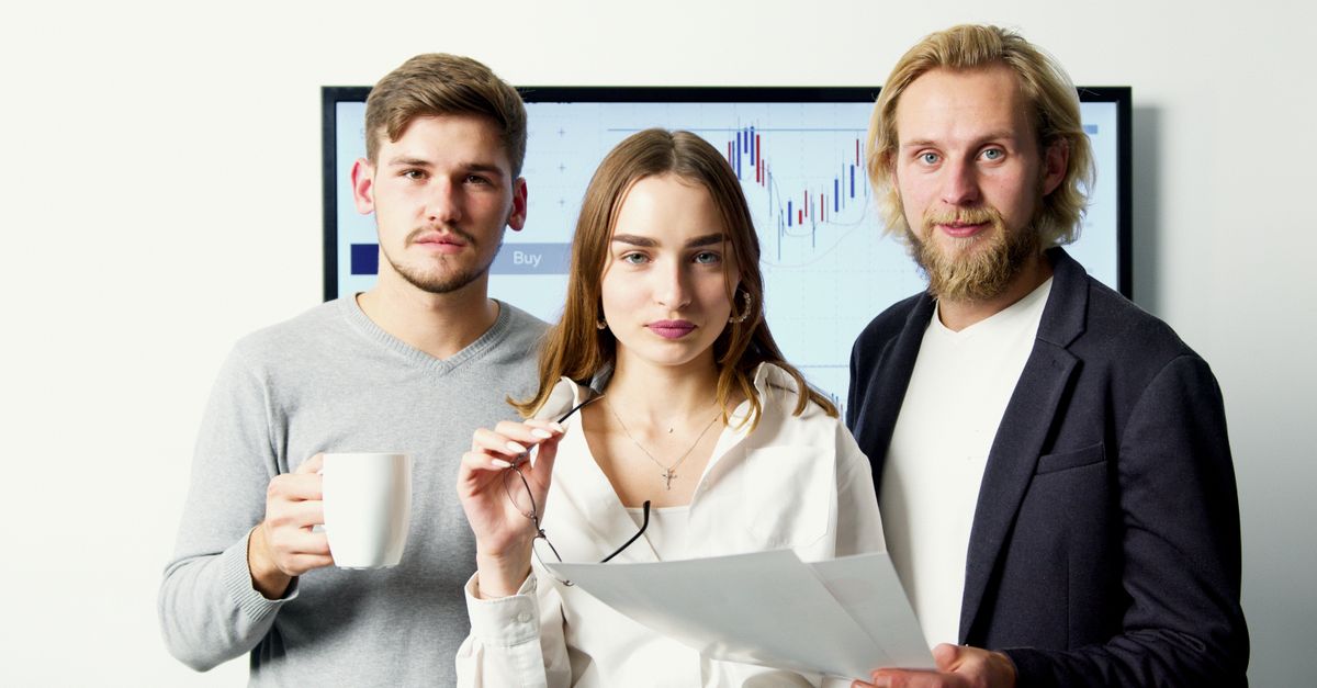 Professional business team discussing financial charts during a meeting in a modern office.