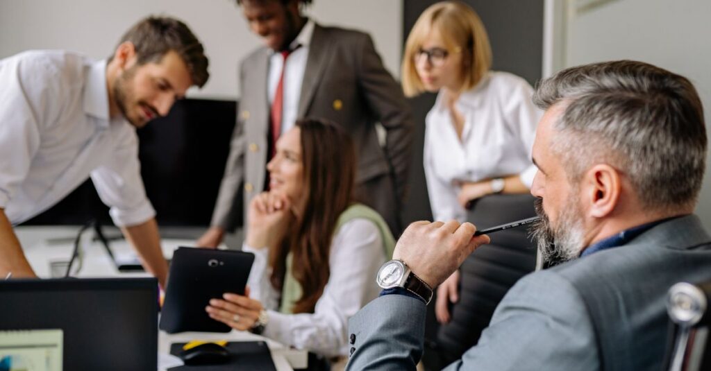 A diverse group of professionals engaging in a collaborative meeting in a modern office setting.