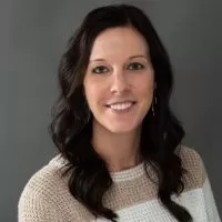 Chelsey L. portrait with a friendly smile, showcasing her role in enhancing productivity and visibility at PracticeERP.