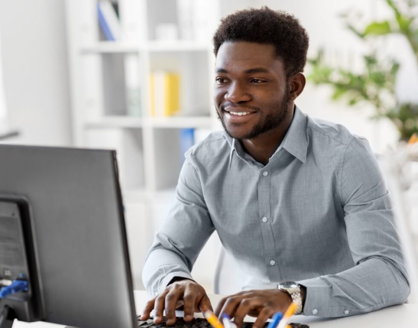 Man Happily Working on His Computer